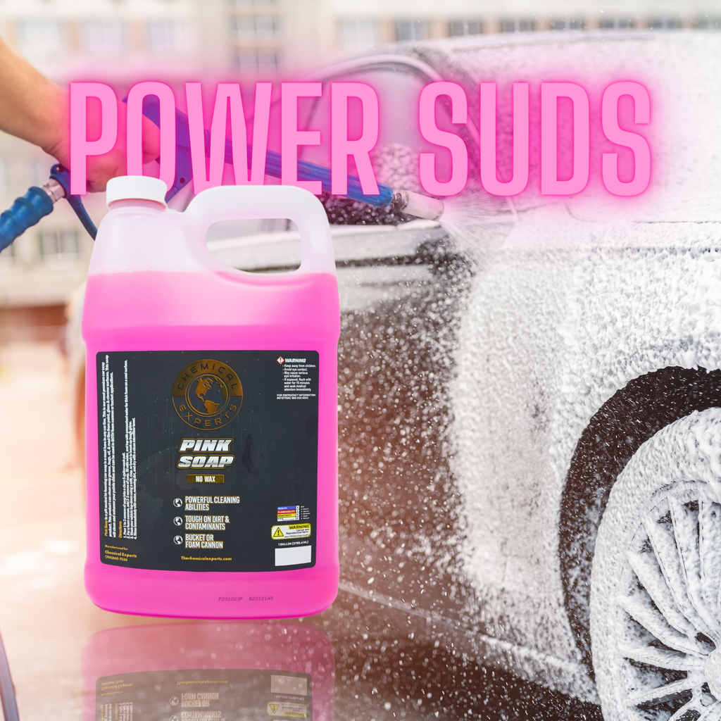 Luxury car covered in frothy foam from Chemical Experts Pink Soap, demonstrating powerful cleaning suds for ultimate vehicle care.